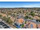 Spectacular aerial view capturing terra cotta-roofed homes nestled in lush landscaping, with a beautiful waterfront community at 8132 Bay Harbor Dr, Las Vegas, NV 89128