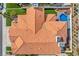 Aerial view displaying terra cotta roofing, desert landscaping, refreshing pool, and air conditioning units at 8132 Bay Harbor Dr, Las Vegas, NV 89128