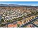 Expansive aerial view of a neighborhood showcasing desert landscaping and mountain backdrop at 8132 Bay Harbor Dr, Las Vegas, NV 89128