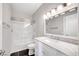 Bathroom showcasing a large vanity with a marble countertop and a shower and tub combo at 8132 Bay Harbor Dr, Las Vegas, NV 89128