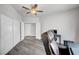 Bright bedroom featuring a ceiling fan, wood floors, and a closet at 8132 Bay Harbor Dr, Las Vegas, NV 89128
