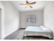 Simple bedroom with neutral walls and floor, features a large window for natural light at 8132 Bay Harbor Dr, Las Vegas, NV 89128
