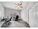 Bright bedroom featuring a ceiling fan, wood floors, and a closet at 8132 Bay Harbor Dr, Las Vegas, NV 89128
