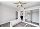 Bedroom featuring a ceiling fan and a sliding mirror door closet at 8132 Bay Harbor Dr, Las Vegas, NV 89128