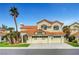 Charming two-story home featuring a three-car garage, desert landscaping, and a classic red tile roof at 8132 Bay Harbor Dr, Las Vegas, NV 89128