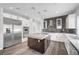 Modern kitchen featuring a large island, stainless steel appliances, and a stylish backsplash at 8132 Bay Harbor Dr, Las Vegas, NV 89128