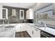 Kitchen boasts an island, gray backsplash, and large windows that fill the room with natural light at 8132 Bay Harbor Dr, Las Vegas, NV 89128