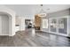 Beautiful open-concept space with a fireplace, wet bar, kitchen, and french doors at 8132 Bay Harbor Dr, Las Vegas, NV 89128
