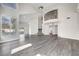 Bright living room with sleek flooring, stairs to the second story, and views of the backyard at 8132 Bay Harbor Dr, Las Vegas, NV 89128