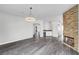 Open living space featuring a fireplace, wet bar, and access to a kitchen at 8132 Bay Harbor Dr, Las Vegas, NV 89128