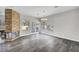 Spacious living room features a stone fireplace, modern lighting, and wood floors at 8132 Bay Harbor Dr, Las Vegas, NV 89128