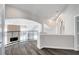 Open loft area with curved railings overlooking a fireplace and a living room at 8132 Bay Harbor Dr, Las Vegas, NV 89128