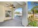 Covered patio with an archway, featuring a ceiling fan and views of the pool and landscaping at 8132 Bay Harbor Dr, Las Vegas, NV 89128