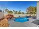 A backyard swimming pool offers a calming water feature and inviting place to cool off, surrounded by mature trees at 8132 Bay Harbor Dr, Las Vegas, NV 89128