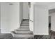 Modern stairway showcasing wood-style steps and neutral walls at 8132 Bay Harbor Dr, Las Vegas, NV 89128