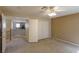 Carpeted bedroom with a ceiling fan and closet, offering ample storage at 9849 Ridge Hill Ave, Las Vegas, NV 89147