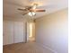 Bedroom featuring a ceiling fan, sliding closet doors and neutral carpet at 9849 Ridge Hill Ave, Las Vegas, NV 89147