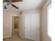 Bedroom featuring sliding closet doors, ceiling fan and natural light at 9849 Ridge Hill Ave, Las Vegas, NV 89147