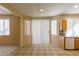 Open dining area with tile flooring and bright, natural light from large windows at 9849 Ridge Hill Ave, Las Vegas, NV 89147