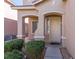 Inviting front entrance with a covered porch and manicured shrubbery at 9849 Ridge Hill Ave, Las Vegas, NV 89147