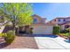 Charming two-story home with a well-maintained front yard and a two car garage at 9849 Ridge Hill Ave, Las Vegas, NV 89147