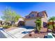Attractive two-story home showcasing a well-kept yard and convenient two-car garage at 9849 Ridge Hill Ave, Las Vegas, NV 89147