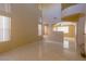 Spacious living room with high ceilings, ample natural light, and tile flooring at 9849 Ridge Hill Ave, Las Vegas, NV 89147