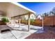 Back patio features an open-air roof, concrete pad, and desert landscaping at 9849 Ridge Hill Ave, Las Vegas, NV 89147