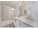 Bright bathroom with double sink vanity and glass-enclosed shower/tub at , Las Vegas, NV 89156