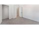 Bright bedroom featuring neutral decor, plush gray carpeting, closet and an ensuite bathroom at , Las Vegas, NV 89156