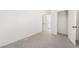 Bedroom featuring neutral decor, plush gray carpeting, and access to the walk-in closet at , Las Vegas, NV 89156