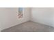 Bedroom featuring neutral decor, plush gray carpeting, and a window at , Las Vegas, NV 89156