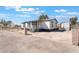 Charming single-story home with a gravel driveway and fenced yard, offering a cozy and private living space at , Las Vegas, NV 89156
