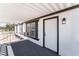 Charming covered front porch with white trim and a bright white front door, enhancing curb appeal at , Las Vegas, NV 89156