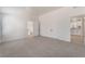 Bright main bedroom with plush carpet, closet with double doors, and open ensuite bathroom access at , Las Vegas, NV 89156