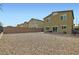 Spacious backyard with privacy fencing and gravel, perfect for outdoor activities at 4454 Lantern Point Ave, North Las Vegas, NV 89084