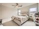 Spacious bedroom with carpet, natural light, and a ceiling fan, offering a comfortable and inviting atmosphere at 4454 Lantern Point Ave, North Las Vegas, NV 89084