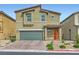 Charming two-story home featuring a two-car garage and drought-tolerant landscaping in a desirable neighborhood at 4454 Lantern Point Ave, North Las Vegas, NV 89084