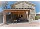 View of the back patio with a covered area and outdoor seating at 10417 Niagara Falls Ln, Las Vegas, NV 89144