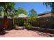 Landscaped backyard featuring a decorative fish pond and mature palm trees at 10417 Niagara Falls Ln, Las Vegas, NV 89144
