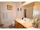 Bright bathroom features a large mirror, spacious sink, and shower/tub with sliding glass doors at 10417 Niagara Falls Ln, Las Vegas, NV 89144