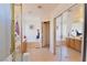 Bright bathroom featuring a glass enclosed shower, dual sinks, and a soaking tub at 10417 Niagara Falls Ln, Las Vegas, NV 89144