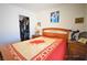 Inviting bedroom with traditional decor including a floral quilt and bedside tables, offers cozy living at 10417 Niagara Falls Ln, Las Vegas, NV 89144
