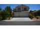 Charming two-story home featuring a well-manicured lawn and a two-car garage, perfect for suburban living at 10417 Niagara Falls Ln, Las Vegas, NV 89144