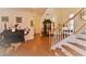 Elegant foyer with a staircase, hardwood floors, and decorative accents, creating a welcoming entrance to the home at 10417 Niagara Falls Ln, Las Vegas, NV 89144