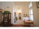 Bright foyer with high ceilings, decorative niches, tile floors, and a view of the front door, creating a grand entrance at 10417 Niagara Falls Ln, Las Vegas, NV 89144