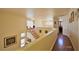 Upstairs hallway with hardwood floors and large windows, providing a bright and airy space at 10417 Niagara Falls Ln, Las Vegas, NV 89144