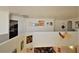 Upper loft area with views of the downstairs living room and decorative wall art, adding character to the space at 10417 Niagara Falls Ln, Las Vegas, NV 89144