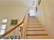 Bright staircase with wood handrail leading to the upper level at 10417 Niagara Falls Ln, Las Vegas, NV 89144