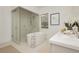 Modern bathroom features a soaking tub, glass shower, and marble countertop at 11700 Belorado Ave, Las Vegas, NV 89138